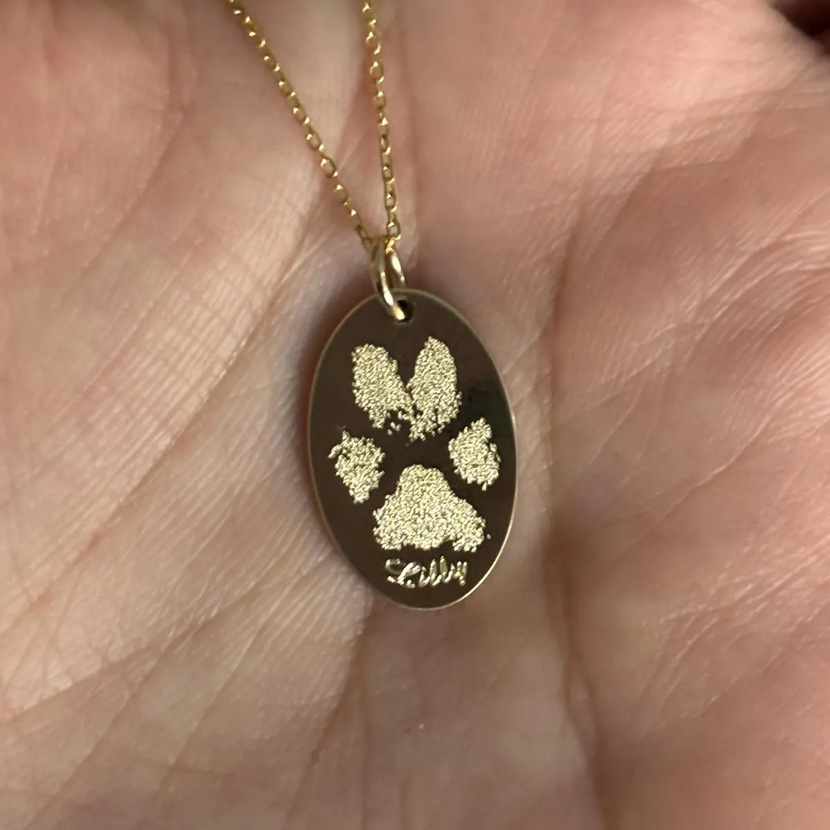 Oval solid 14k yellow gold actual paw print pendant