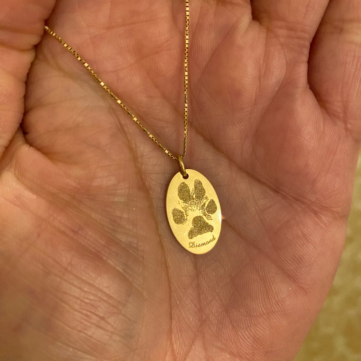 Oval solid 14k yellow gold actual paw print pendant